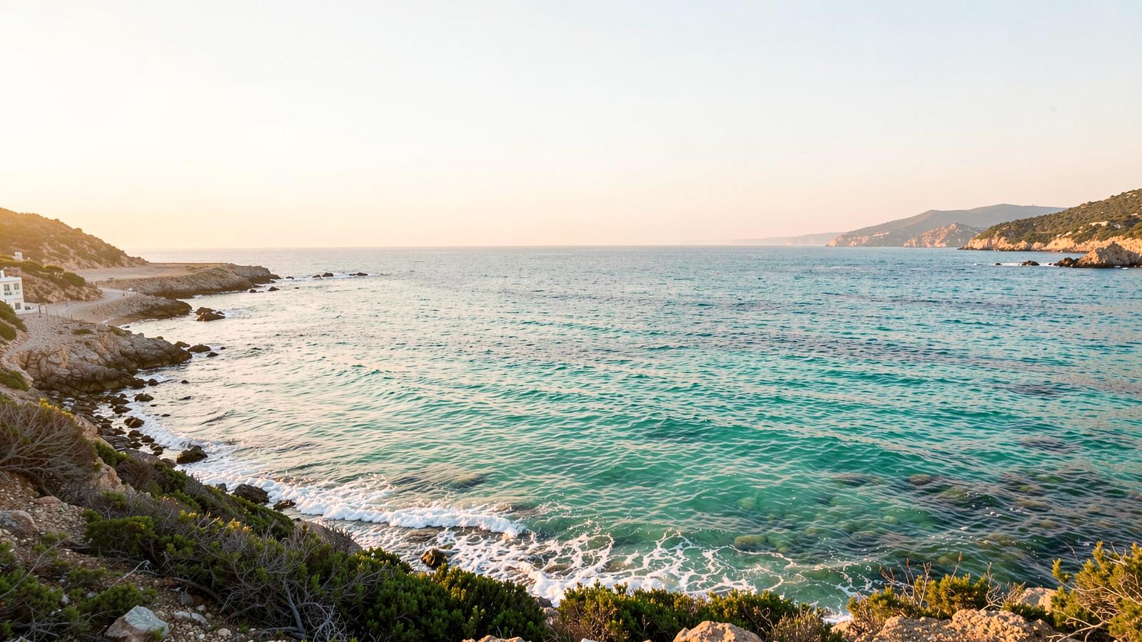 A calm turquoise cove in soft morning light