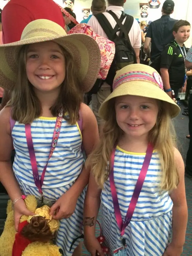 The girls in sun hats on a Disney cruise