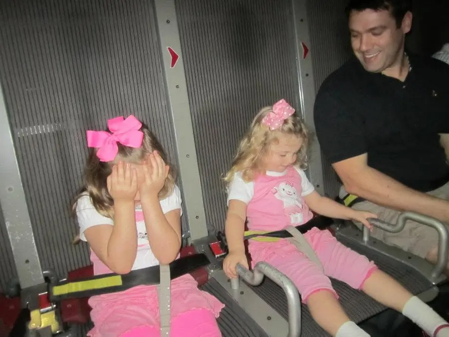 The girls buckled in for Soarin at EPCOT