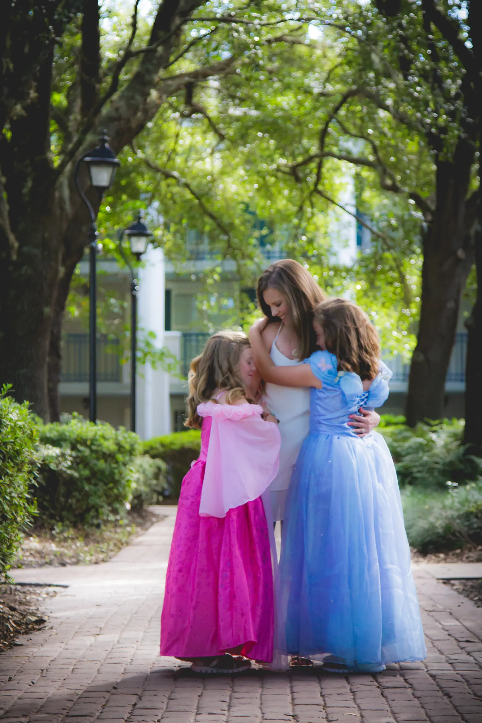 Ashlee hugging her oldest daughter in a princess dress
